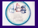 Round AquaCast resin snowman tray with three illustrated snowmen and “Baby it’s cold outside” text.