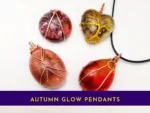 Set of four autumn glow resin pendants with copper wire wrapping in red, amber, pink and earthy tones – handmade jewellery collection