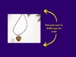 Heart-shaped resin pendant with yellow wire-wrapped tree design shown next to a £1 coin for size comparison – handmade necklace by Kirnix Creations
