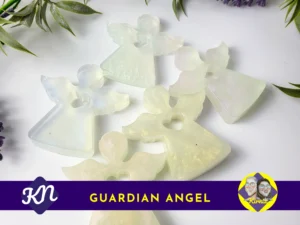 Five iridescent resin Guardian Angels arranged on a white background with greenery.