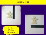 Resin Guardian Angel placed next to a ruler to show horizontal measurement.