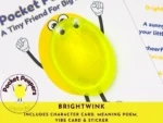 Close-up of the Brightwink Pocket Peepers stone attached to its character card, highlighting included sticker and poem card