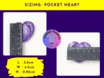 Pocket Peepers heart-shaped fidget pebble measured against a ruler to show its size in centimetres.