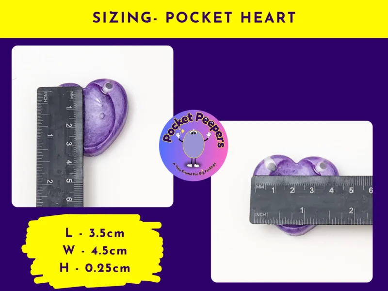 Pocket Peepers heart-shaped fidget pebble measured against a ruler to show its size in centimetres.