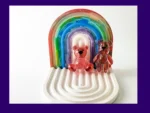 red resin Worry Bear handheld and keyring pair displayed on white rainbow arch tray – small resin worry bears for anxiety