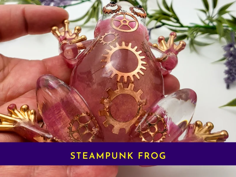 Closeup of steampunk frog showing embedded gears and metallic detailing.