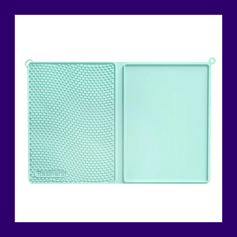 Resiners silicone work mat with textured mixing area and smooth tray area.