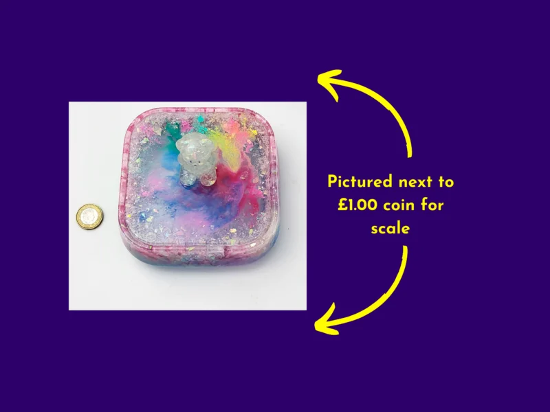 Top-down photo of the treasure box next to a £1 coin to show size.