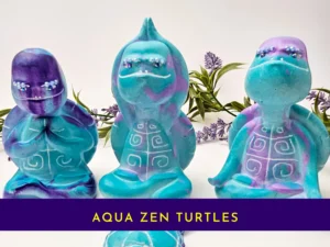 “The full Aqua Zen Turtle Trio displayed together, showing all three OOAK figurines in their unique zen poses.”