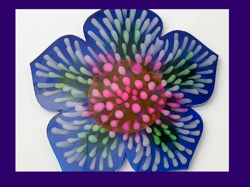 “Full top-down view of the firework bloom resin coaster displaying its symmetrical multicolour bloom pattern.”