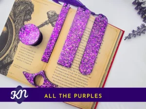 “All the Purples” hero image showing the full purple glitter set on an open book with banner text.