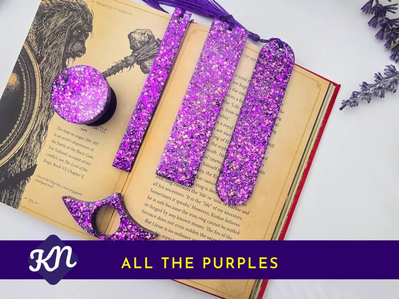 “All the Purples” hero image showing the full purple glitter set on an open book with banner text.