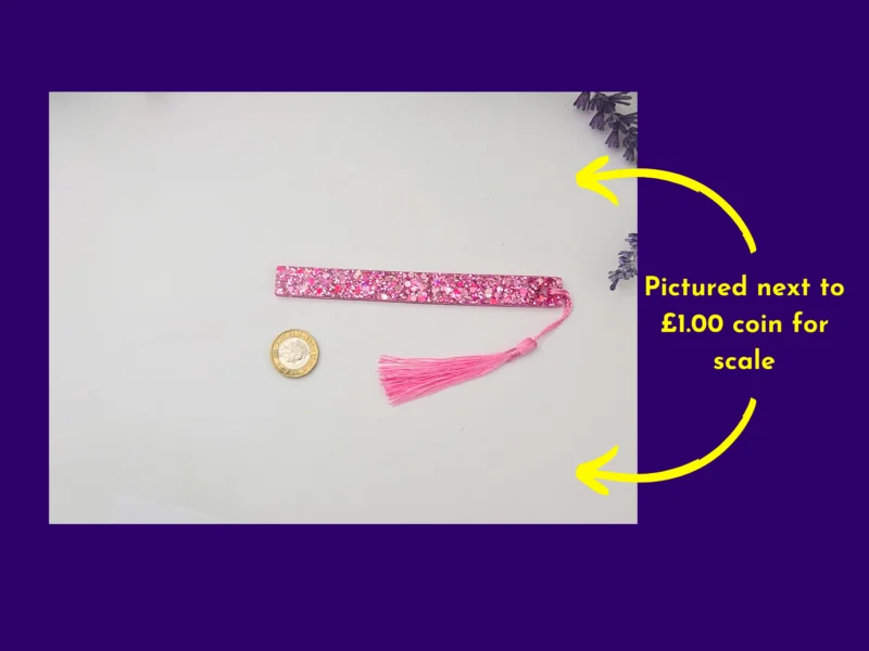 Pink glitter bookmark beside a coin for scale, with arrows and “coin size” callout.